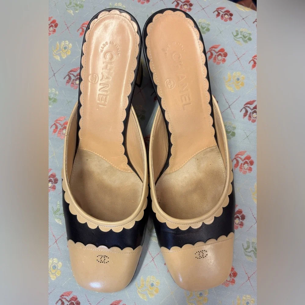 CHANEL Two-Tone Scalloped Leather Mules in Beige and Black